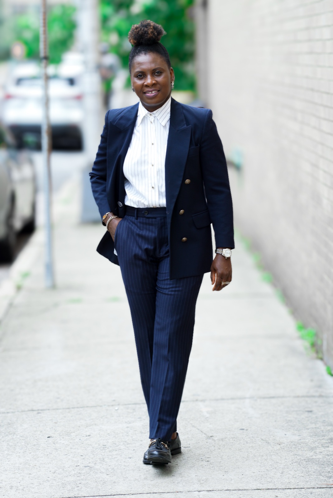 Mo in a custom navy pinstripe suit