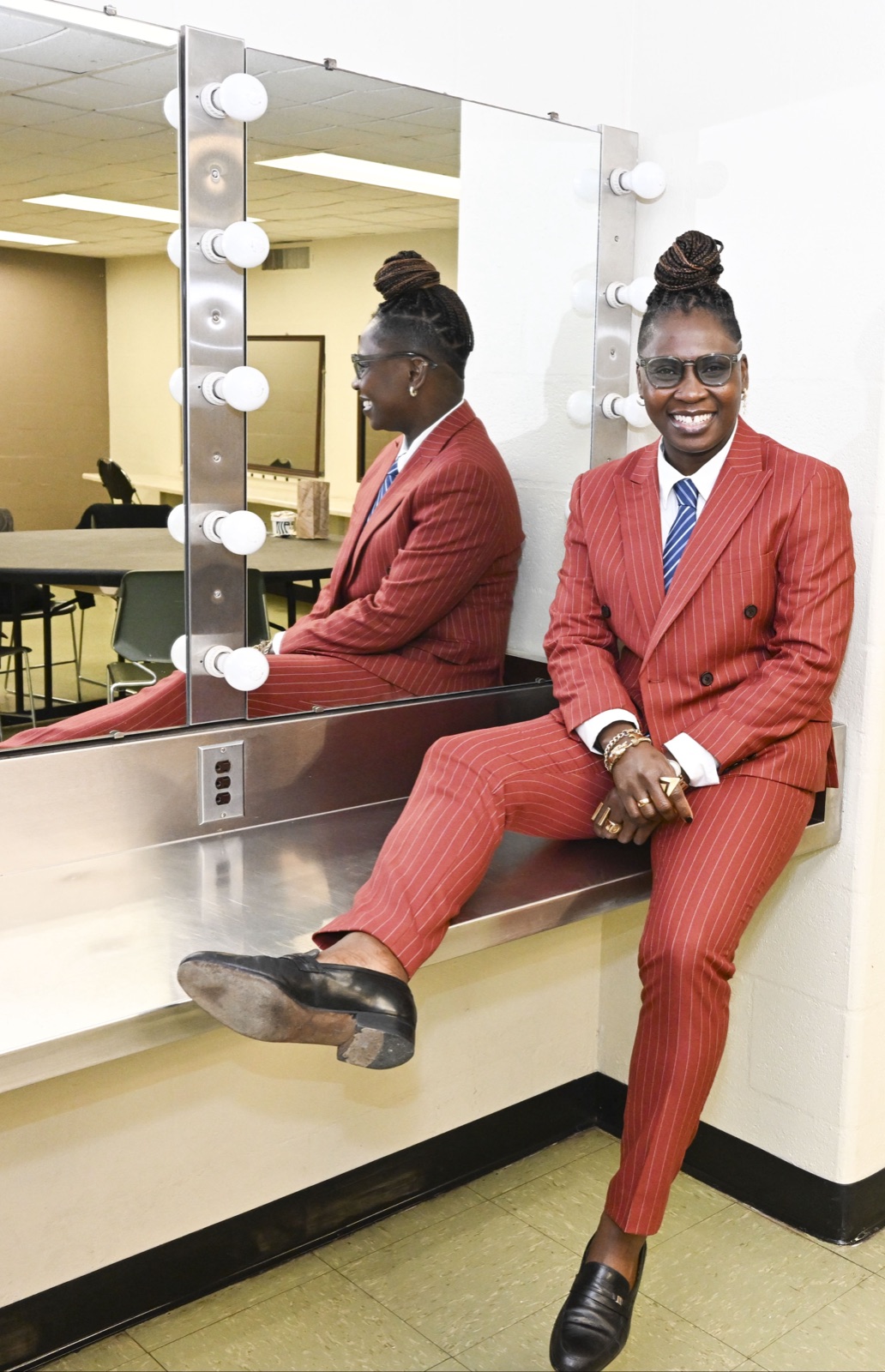 Mo, owner of European Tailoring, in a custom rust pinstripe suit